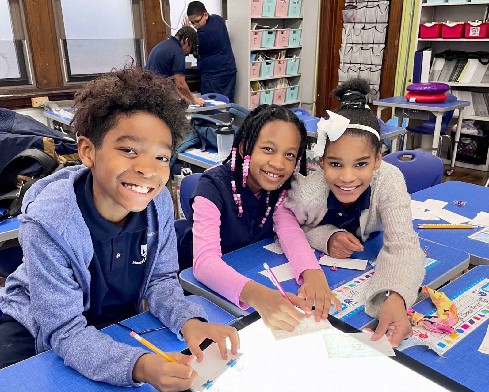 three students at after school academy