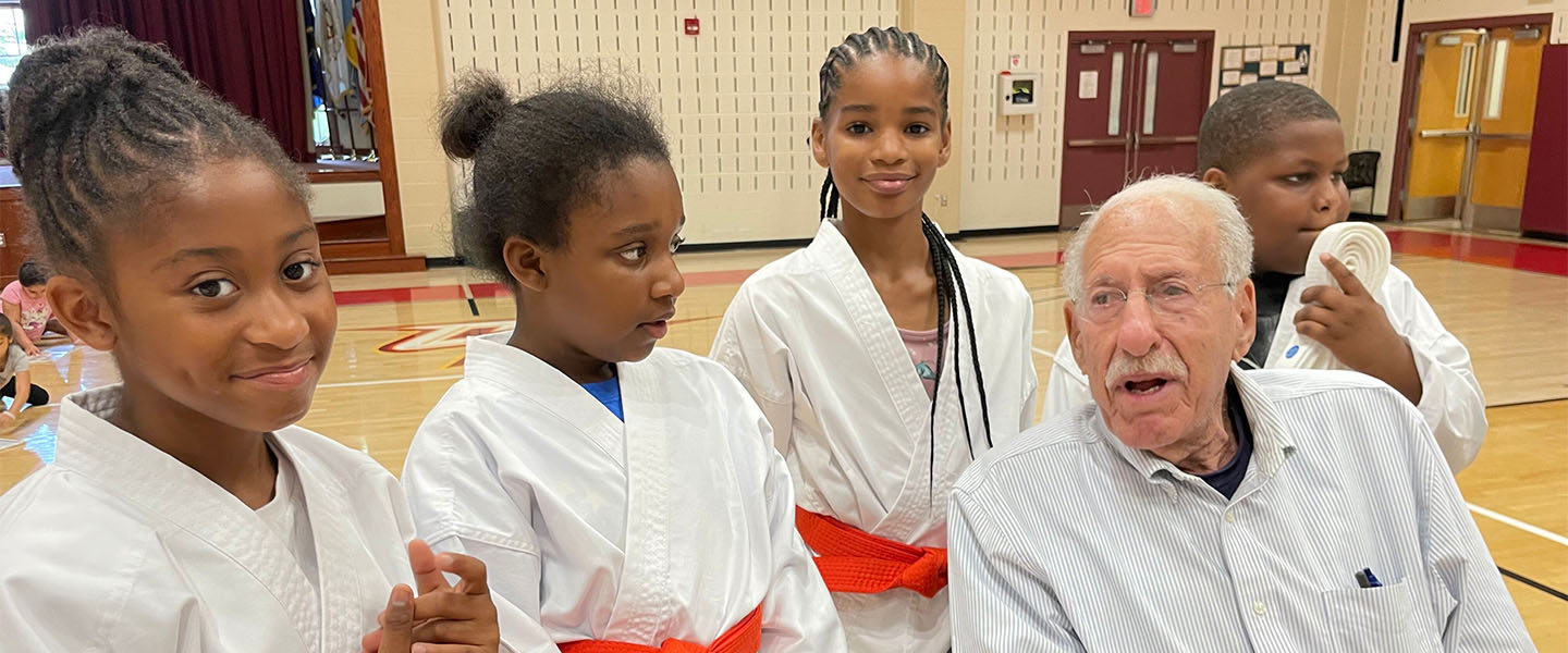Board member with karate students